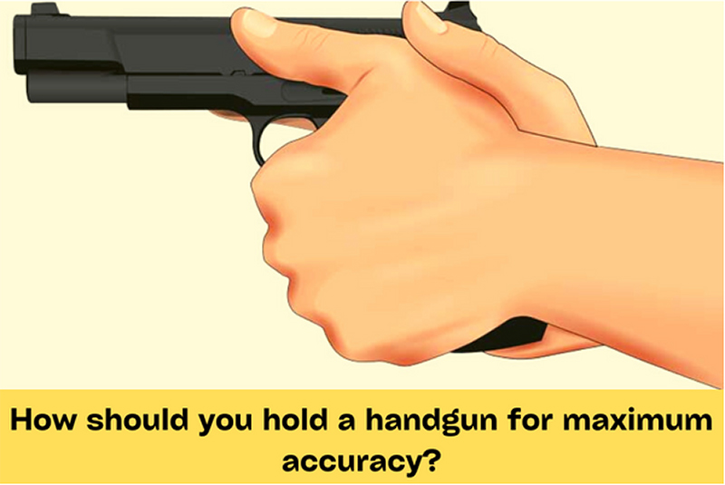 How should you hold a handgun for maximum accuracy?